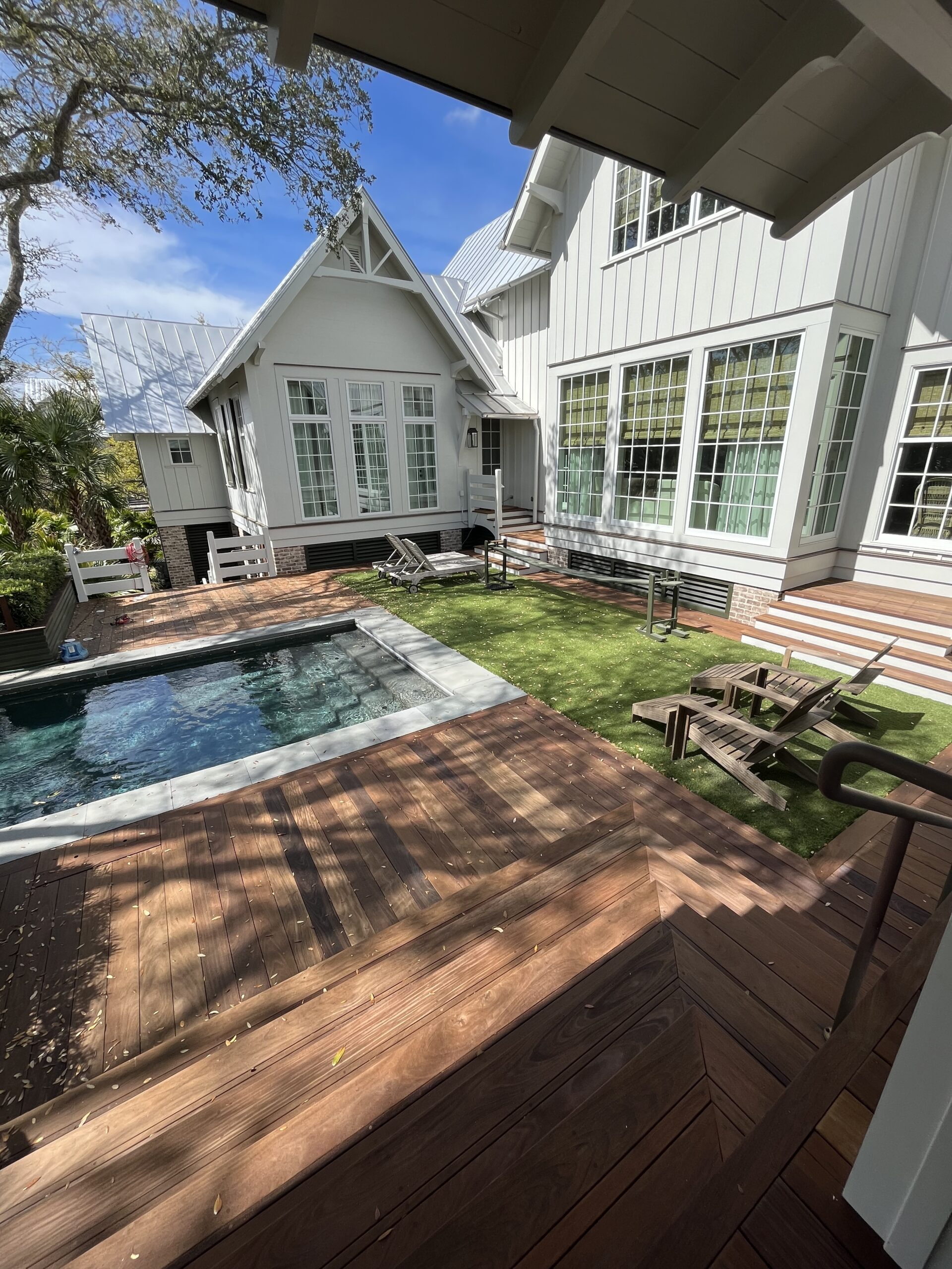 Handyman team working on summer home exterior upgrades in Lansing