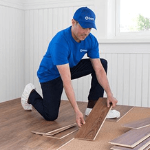 Flooring handyman installing new hardwood flooring